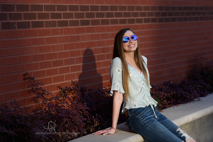 Senior Girl with sunglasses in direct sunlight