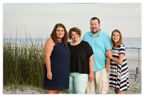 Family Session for 4 on the Beach at Santa Rosa, Florida on the Emerald Coast with sea grass and ocean waters on white sandy beach.
